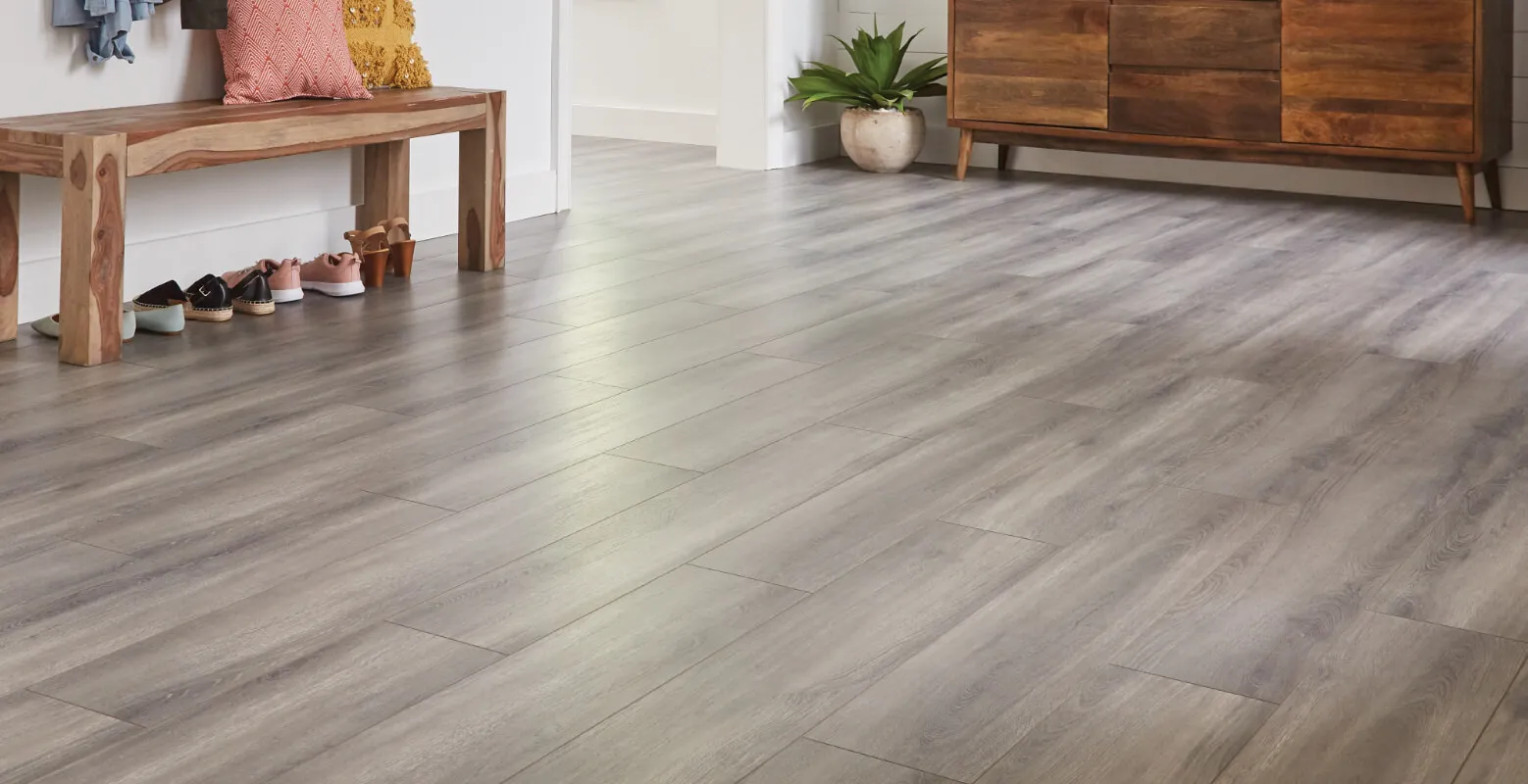 Wood-look laminate flooring installed in a DMV family room by F&F Surface Group