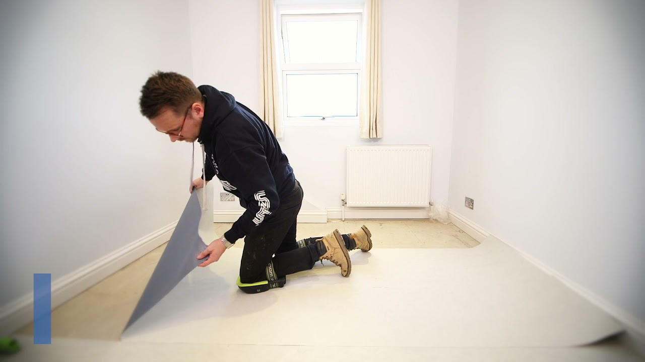 Hardwood floor being sanded and refinished by an F&F Surface Group craftsman