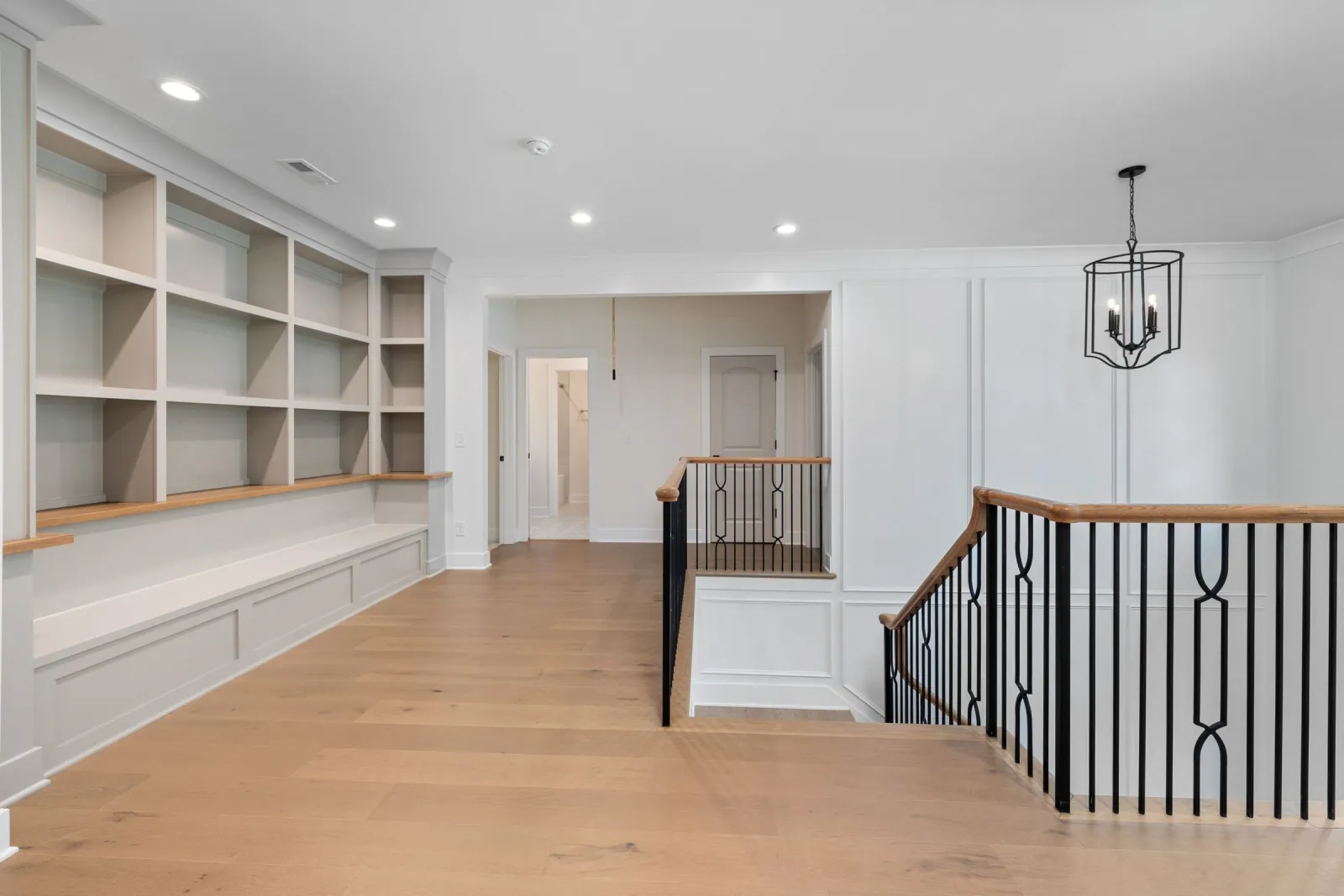 Solid hardwood floor and staircase in a modern foyer