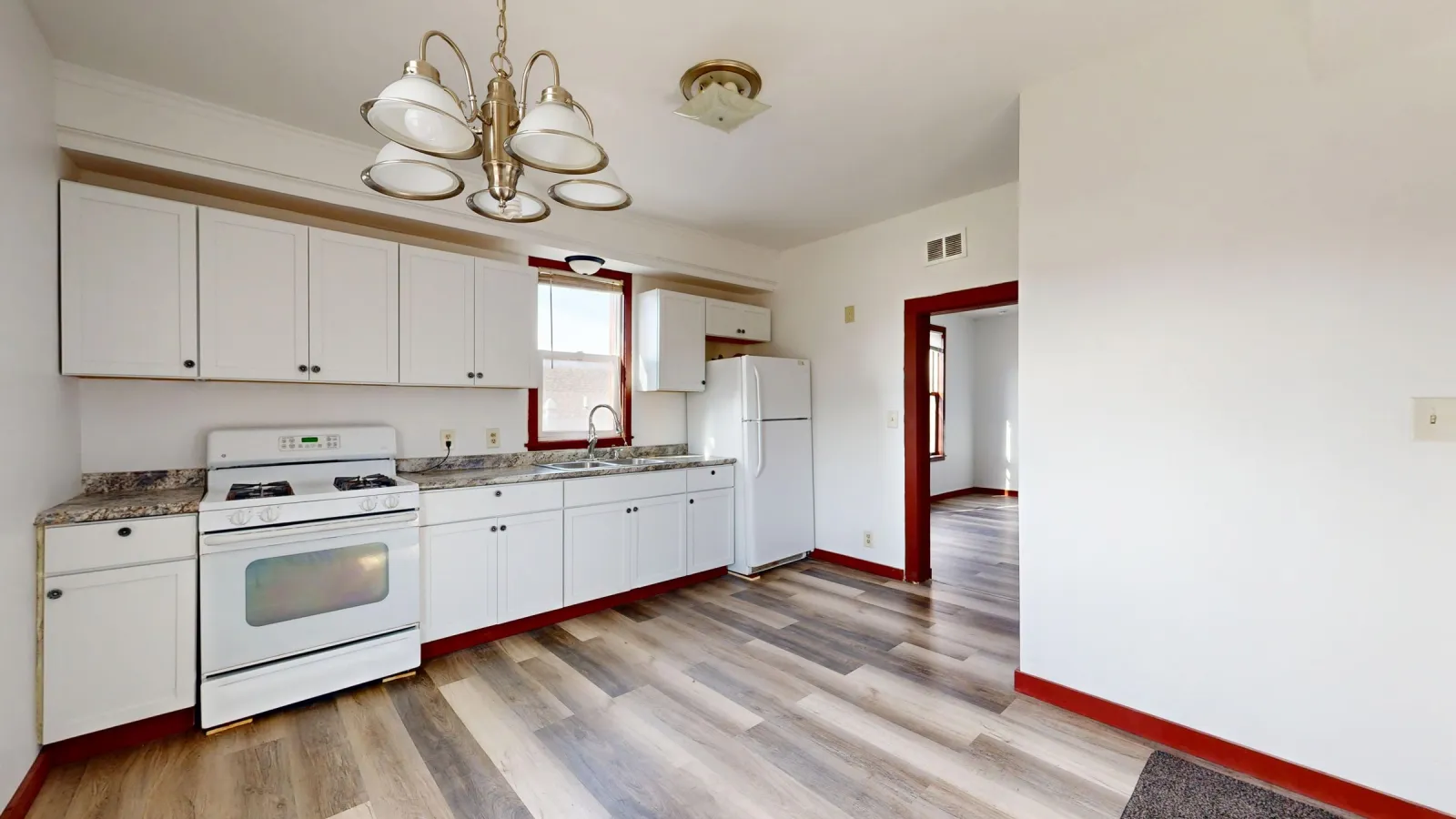 Laminate flooring paired with white kitchen cabinets — Fairland, MD area