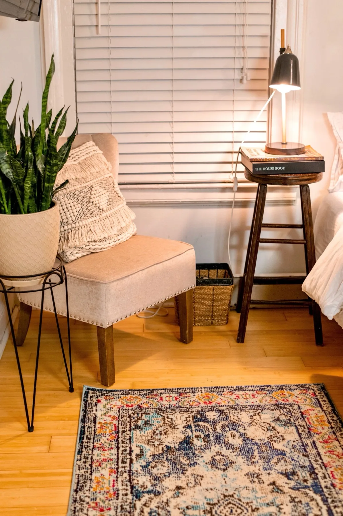 Wood-look luxury vinyl plank flooring in a warm, furnished bedroom — Davidsonville, MD area