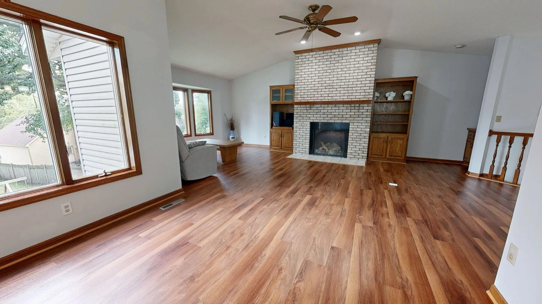 Prefinished hardwood flooring installed in a warm, sunlit DMV family room