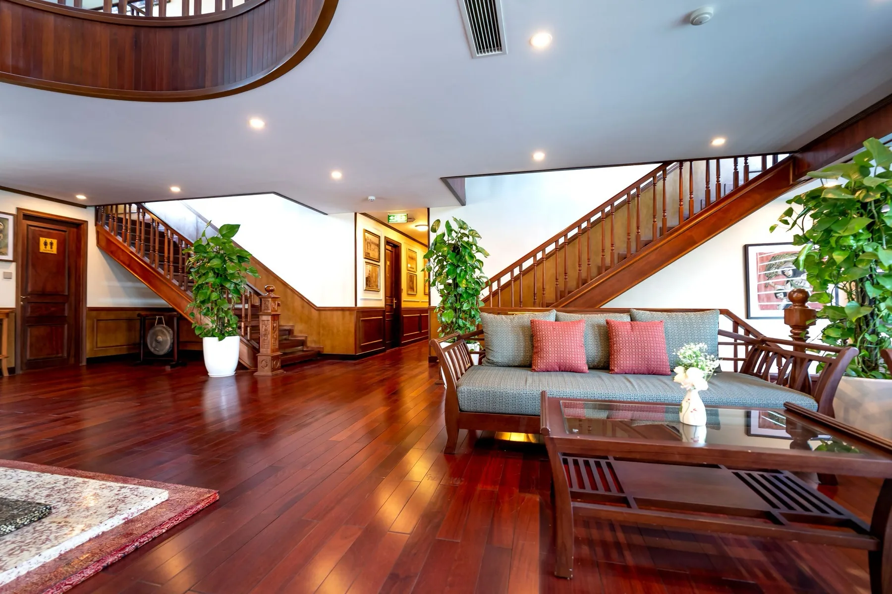 Hardwood floor being sanded and refinished by an F&F Surface Group craftsman