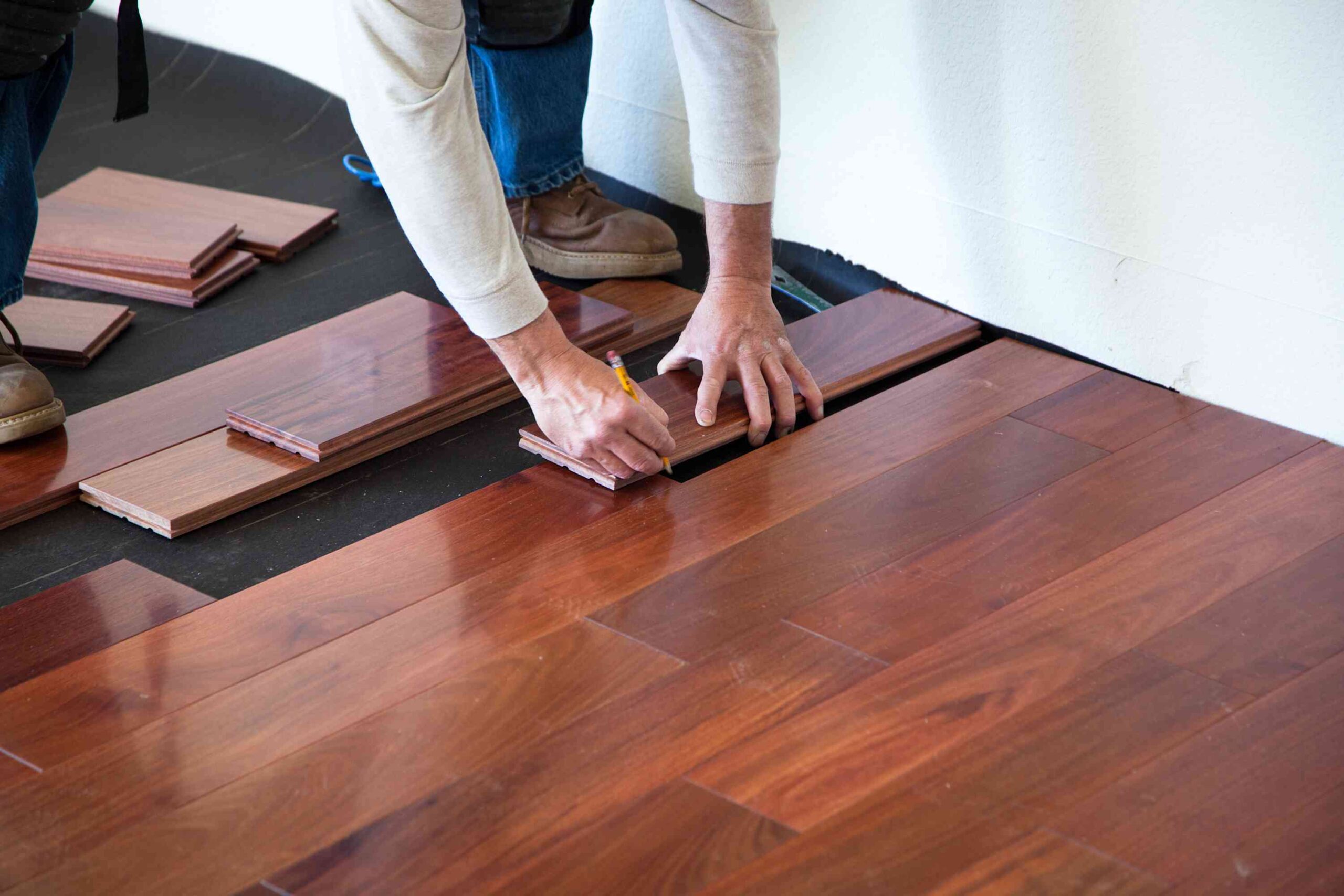Tile transitioning to hardwood in an open floor plan
